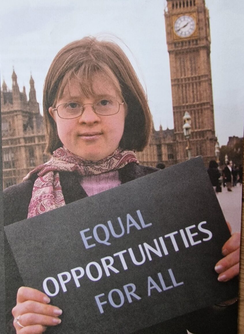 Jen holding banner equal opportunities for all outside Westminster