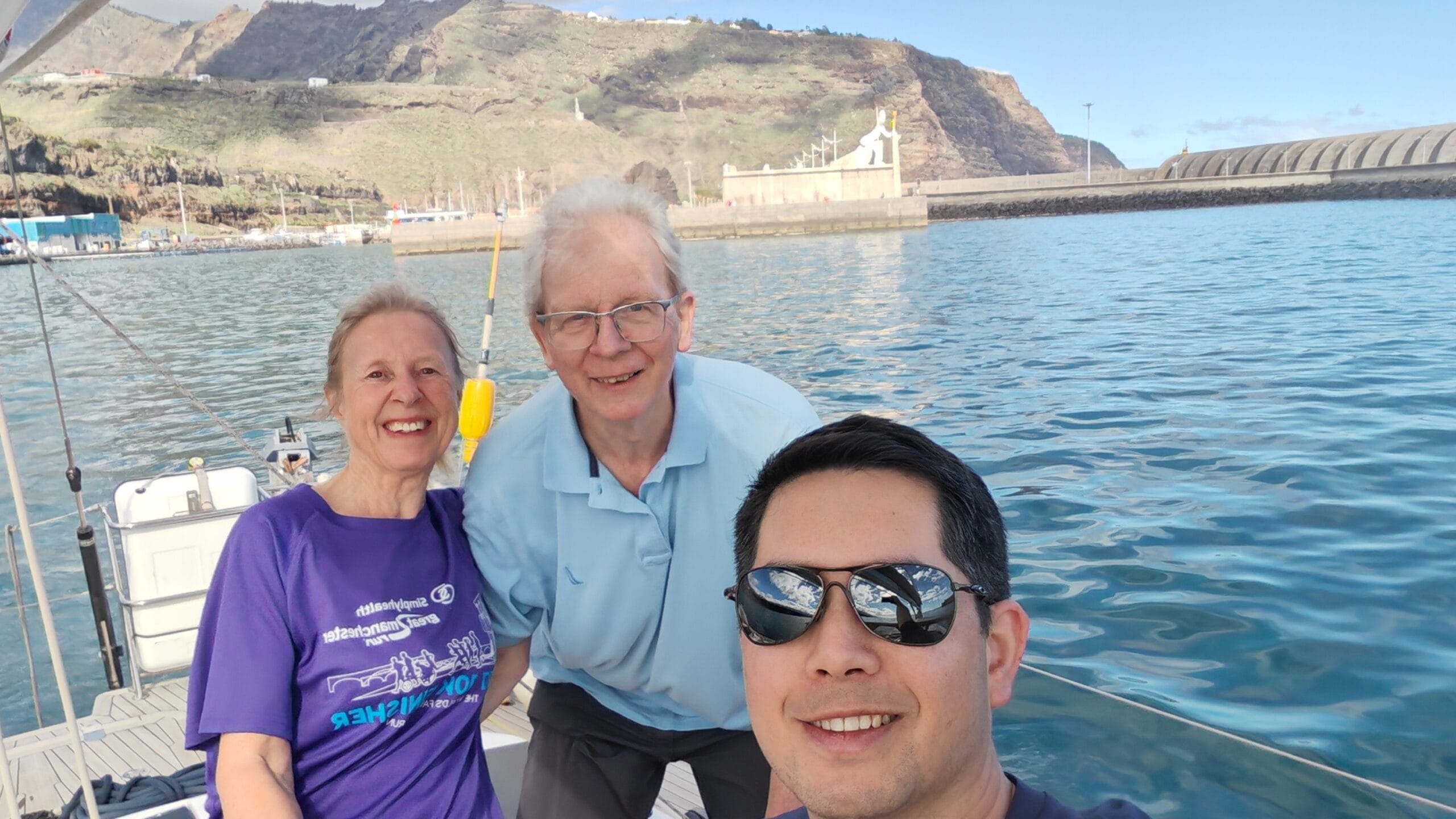 3 people on a yacht leaving La Palma to cross the atlantic ocean
