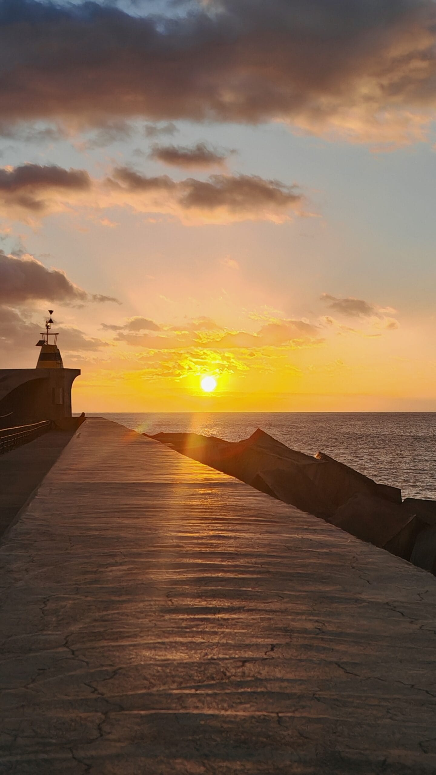 Sun setting over sea
