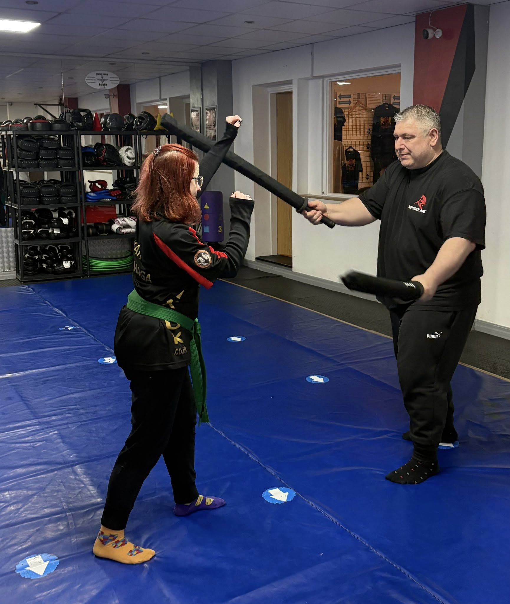 Martial arts small woman with a bigger man 
